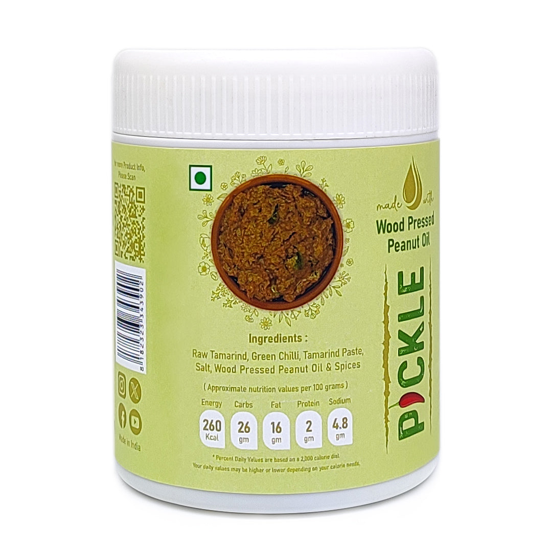 Raw tamarind pickle jar with nutrition details made using wood pressed oil, traditional Andhra chintakaya pickle