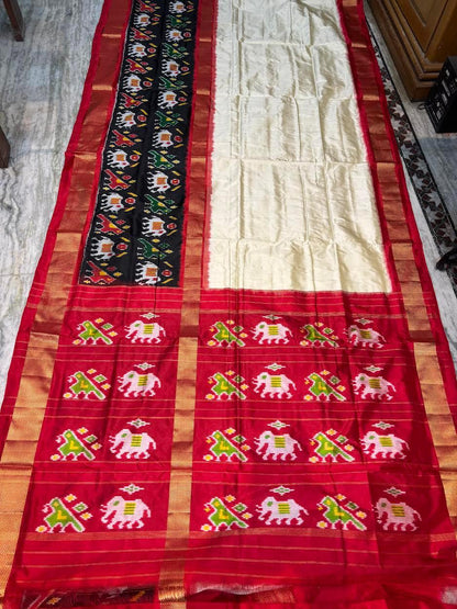 Traditional Cream & Red Ikkat Silk Saree with Black Elephant Motif Border | Pochampally Handloom - pochampallysarees.com