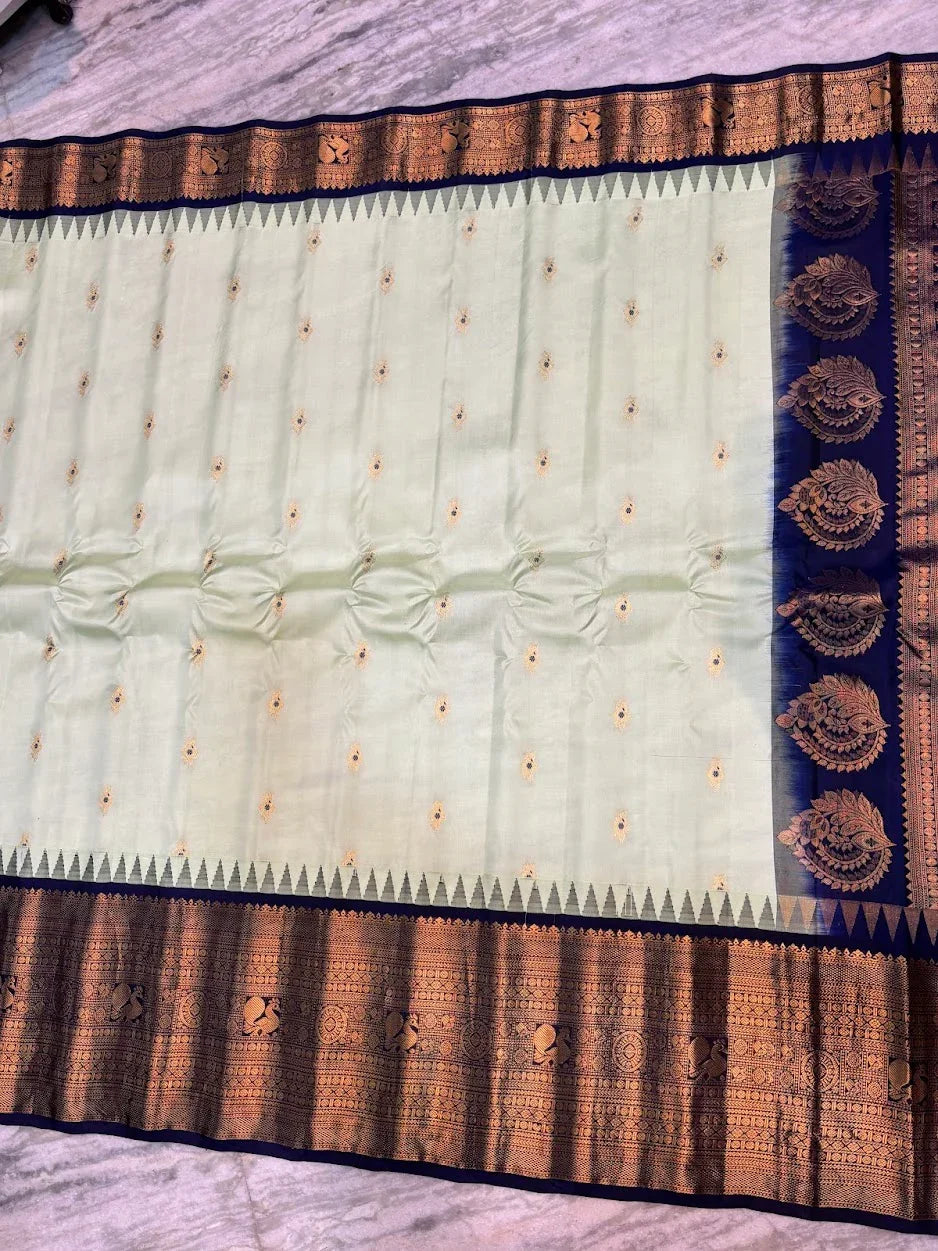 Pure Gadwal Silk Saree in Pastel Mint Green with Navy Blue Temple Border & Grand Gold Zari Pallu | Traditional Handloom Wedding Saree - pochampallysarees.com