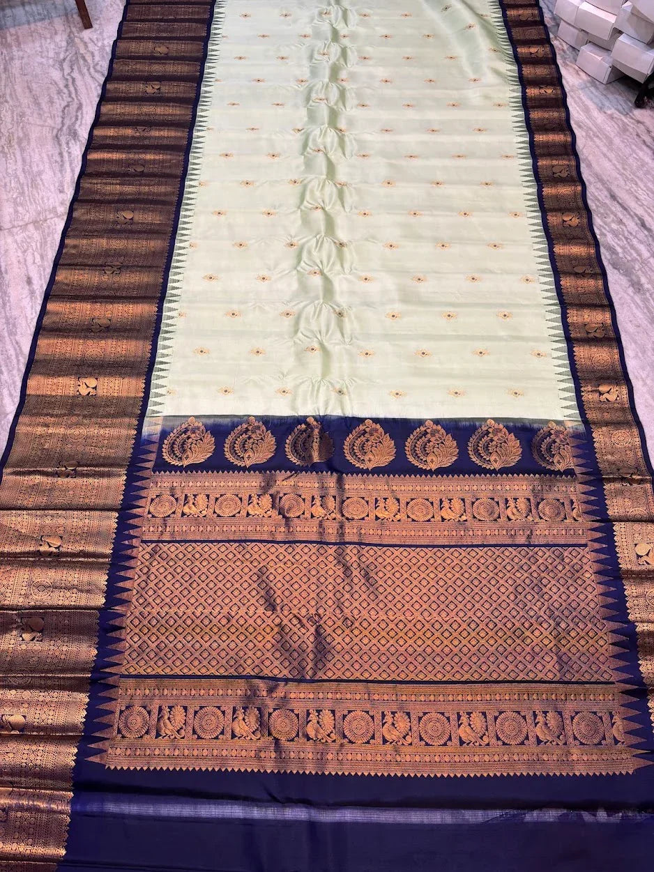 Pure Gadwal Silk Saree in Pastel Mint Green with Navy Blue Temple Border & Grand Gold Zari Pallu | Traditional Handloom Wedding Saree - pochampallysarees.com