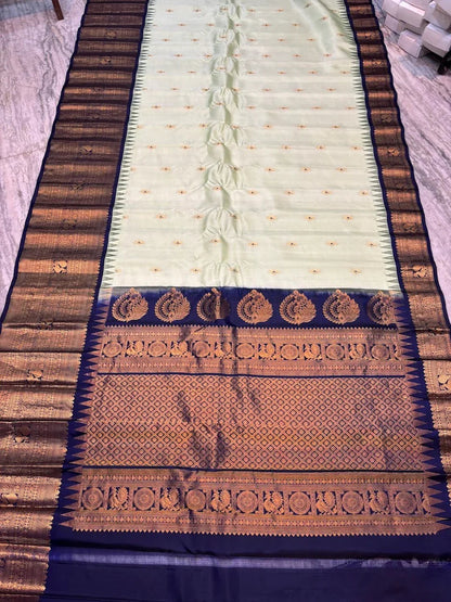 Pure Gadwal Silk Saree in Pastel Mint Green with Navy Blue Temple Border & Grand Gold Zari Pallu | Traditional Handloom Wedding Saree - pochampallysarees.com