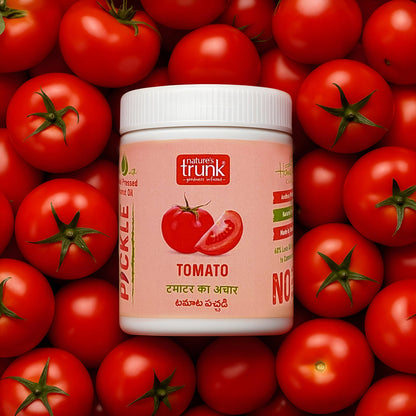 Nature’s Trunk tomato pickle jar surrounded by fresh ripe tomatoes, traditional homemade tomato pickle with rich flavor